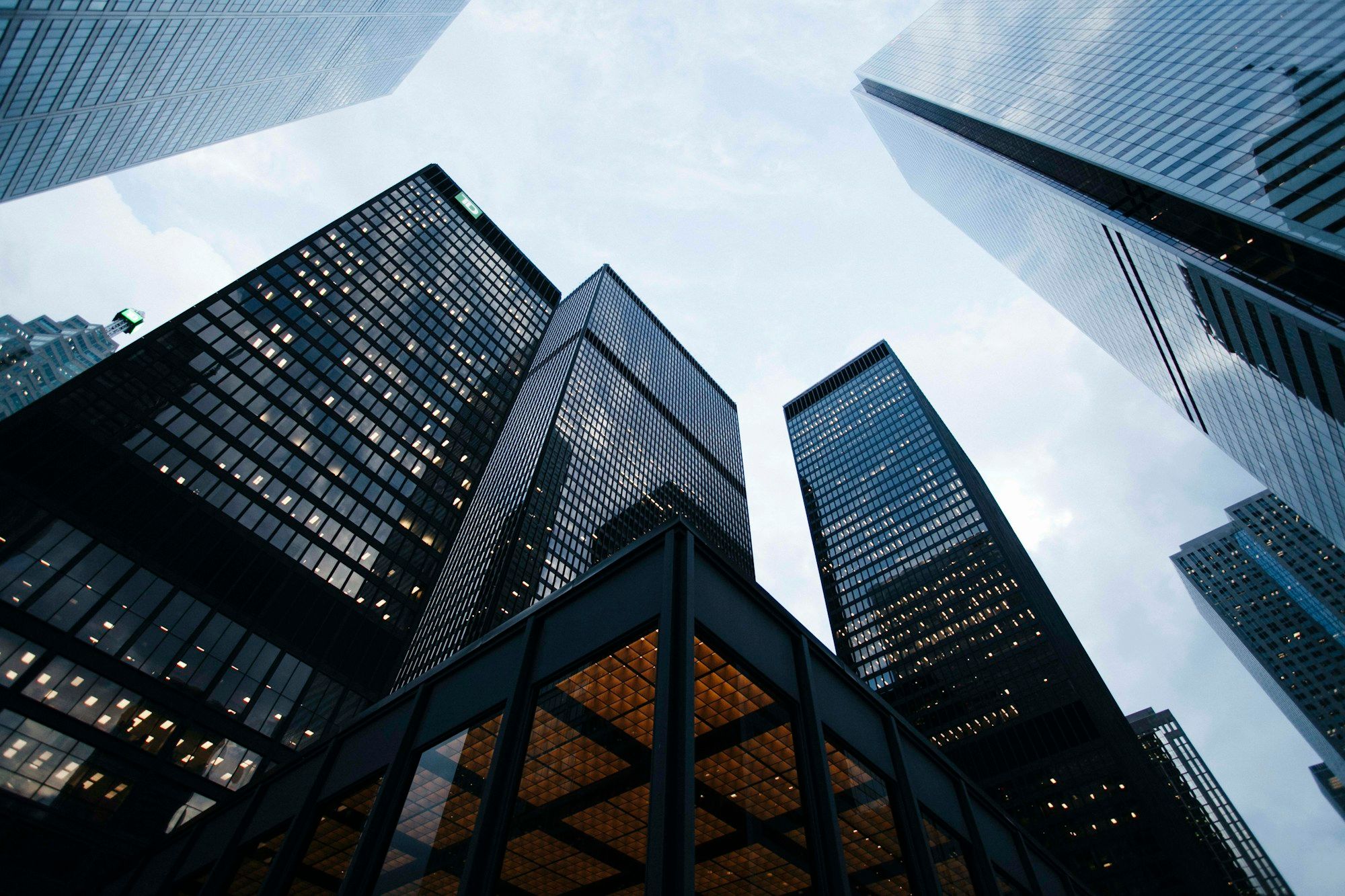 Architectural detail of intersecting glass façades, used as illustrative imagery